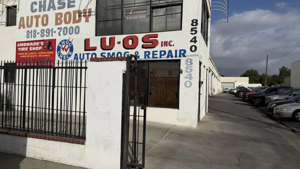 Chase Auto Body storefront at 8540 North Hills showing service bays car repair smog check and tire shop facility