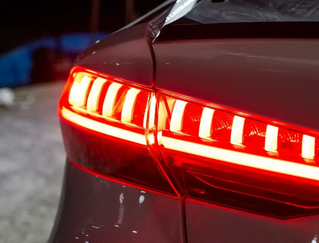 Illuminated LED tail lights being verified during VSSI Brake and Lights Inspection at Chase Auto Body North Hills